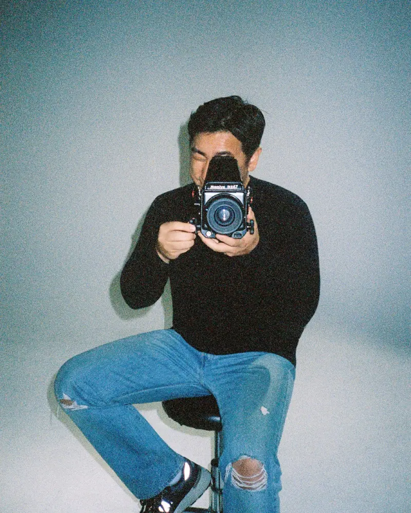 Andy Kim with a medium format camera in the studio
